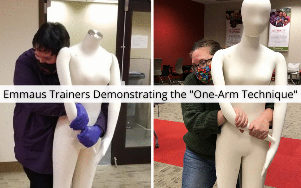 Emmaus Trainers demonstrating the one arm technique on a mannequin