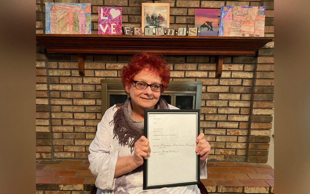 Emmaus client, Denise, with her artwork