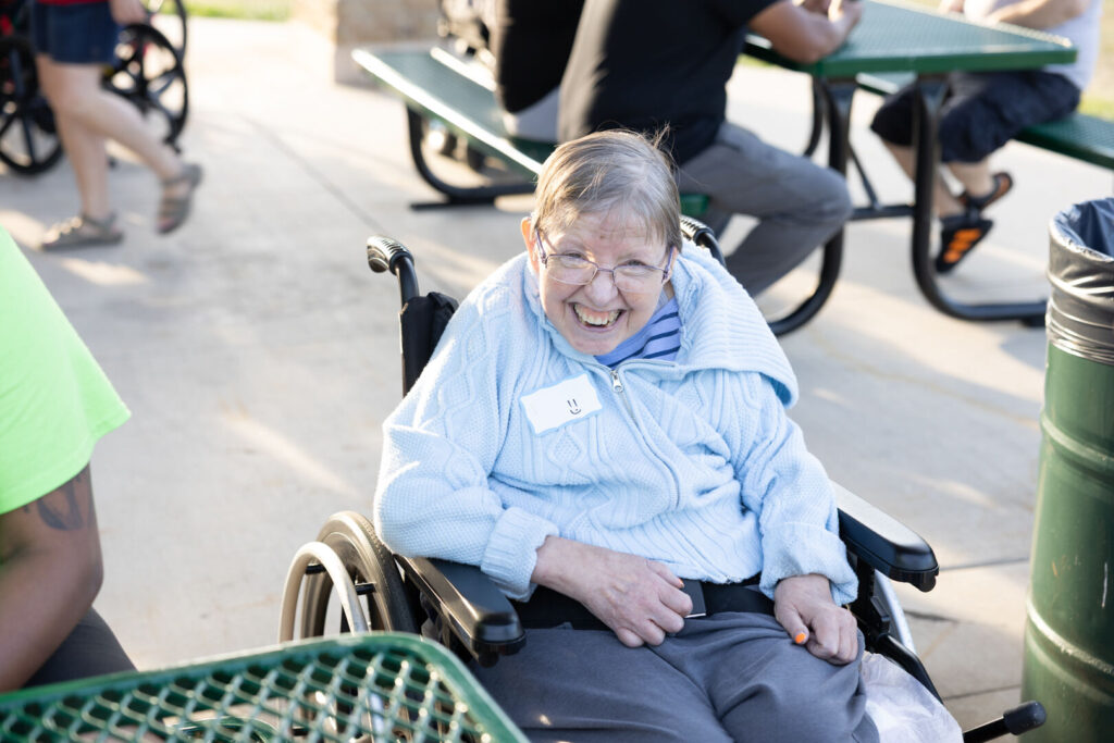 Lady in Wheelchair at Emmaus Homes Event