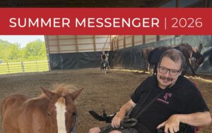 Emmaus Homes client in wheelchair enjoys equine therapy with horse at St. Charles, MO disability services farm