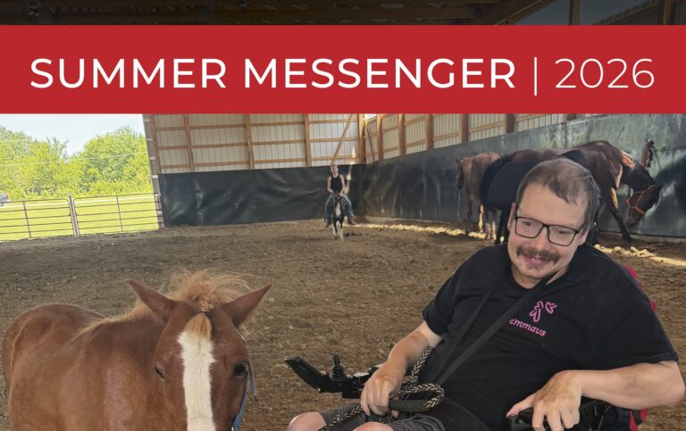 Emmaus Homes client in wheelchair enjoys equine therapy with horse at St. Charles, MO disability services farm